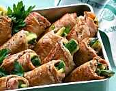 Close-up of schnitzel filled zucchini in baking tray