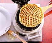 Waffle being made from the waffle iron