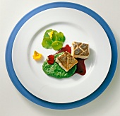 Crispy salmon cube with watercress puree on plate