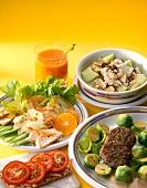 Patty with sprouts, chicken salad, melon with cereal, tomatoes on crisp bread and juice