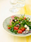 Close-up of melon and feta salad with lamb