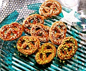 Close-up of pretzels with sesame seed and pistachios on top