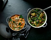 Two pots with carrot and lentil stew and bean stew with pears, overhead view