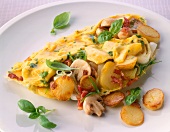 Close-up of omelette with mushrooms, potatoes and leeks in dish