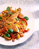 Close-up of chicken stew with rice, peppers, onions, tomatoes and basil