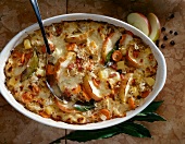 Close-up of sour cabbage with apples and carrots in casserole