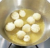 Close-up of mushrooms being cooked in pan, step 5