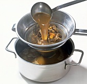 Filtering mixture through sieve in pot, step 3