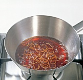 Red wine with julienne in pan, step 1