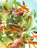 Close-up of fennel salad with mortadella, carrots and walnuts