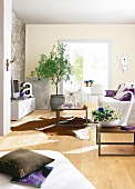 Living room with stone and beige coloured wall, couch and coffee table