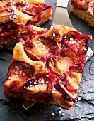 Close-up of plum cake with sour cream