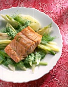 Close-up of salmon fillet with dill leaves on plate