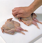 Quail being pressed on chopping board, step 5