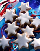 Close-up of cinnamon stars on blue glass plate