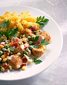 Close-up of vegetable stew with turkey and fusilli on plate