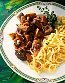 Close-up of venison goulash with spaetzle on plate
