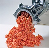 Meat being minced in mincer, step 1