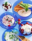 Various dish made from yogurt on blue plates