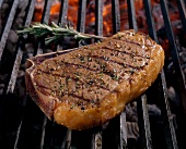 Close-up of beef sirloin steak on grill