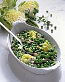 Peas, lettuce, bacon and parsley in serving bowl