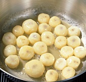 Close-up of water chestnuts in pan