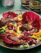 Close-up of radicchio salad with rice and liver on plate