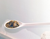 Close-up of salsa verde sauce on white spoon