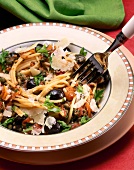 Close-up of spaghetti with olive and capers on plate