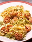 Close-up of tagliatelle with scampi and leeks on plate