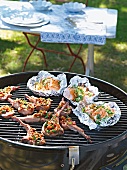 Close-up of teriyaki salmon with lamb chops on grill