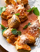 Close-up of turkey meat in tomato and coconut sauce on plate