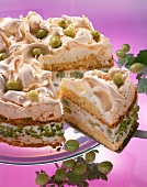 Close-up of gooseberry meringue pie on plate with one piece of pie on spatula