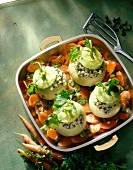 Stuffed kohlrabi with carrots, pistachios and veal meat in cooking pan