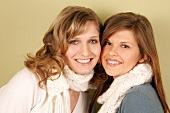 Portrait of Magdalena and Charlotte women wearing scarf and sweater, smiling