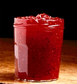 Raspberry and grapefruit red marmalade in glass jar