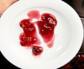 Close-up of sour cherry and ginger jam on plate