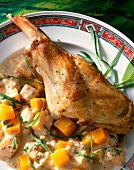 Braised rabbit with pumpkin sauce and herb on plate