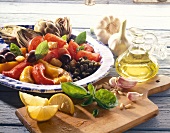Antipasti with figs, tomatoes, mozzarella, fruit on plate
