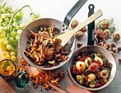 Meat with mushrooms and fruit with berries in pan