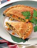 Close-up of calzone with vegetable filling on plate