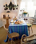 Table with blue checkered table cloth and breakfast laid out