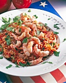 Rice with tomatoes, shrimp, bacon, chilli and garlic on plate