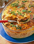 Close-up of mince and vegetables with potatoes, tomatoes and eggplant in casserole