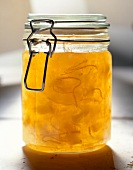 Close-up of yellow jam in glass jar
