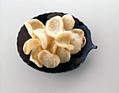 Crab chips in black serving dish