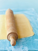 Close-up of dough rolled out with rolling pin