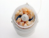 Fish fillet in electric chopper for preparation of fish puree