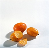 Small orange spondias purpurea on white background
