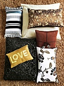 Cushions in black, brown, beige, red, yellow, mix pattern and love inscription